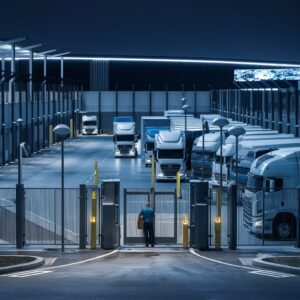 Image depicting a crowded truckstop with trucks parked haphazardly due to limited parking space.